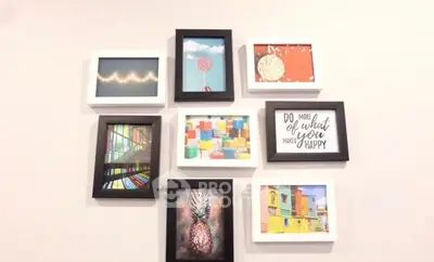 Stylish wall art arrangement in modern living room interior design.