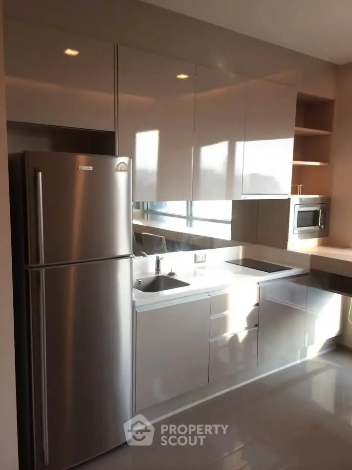 Modern kitchen with sleek cabinetry and stainless steel appliances