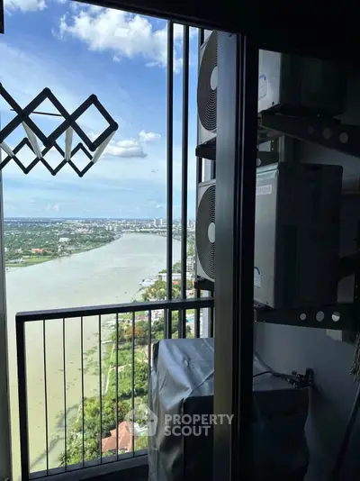 Stunning river view from high-rise balcony with air conditioning units.