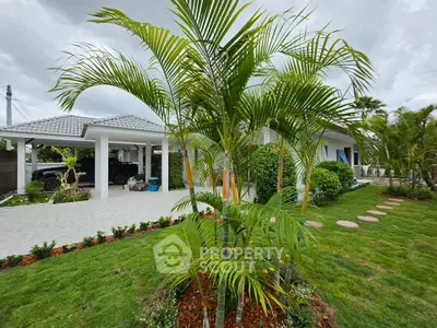 Beautiful suburban home with lush garden and spacious driveway, perfect for family living.