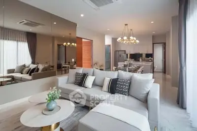 Luxurious modern living room with elegant decor and open kitchen layout