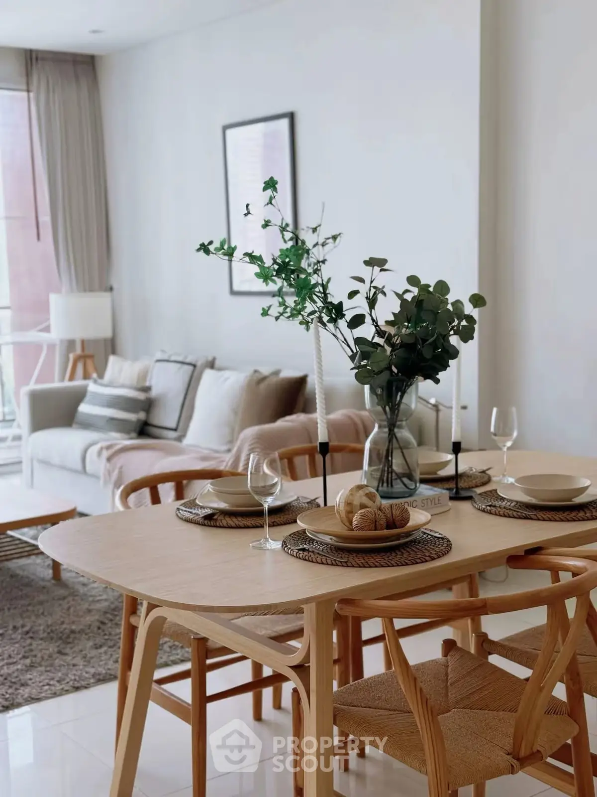 Elegant open-plan living and dining area with stylish decor and natural light