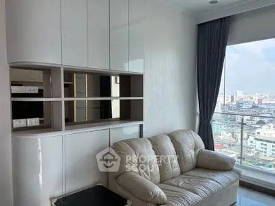 Modern living room with city view and sleek storage cabinets