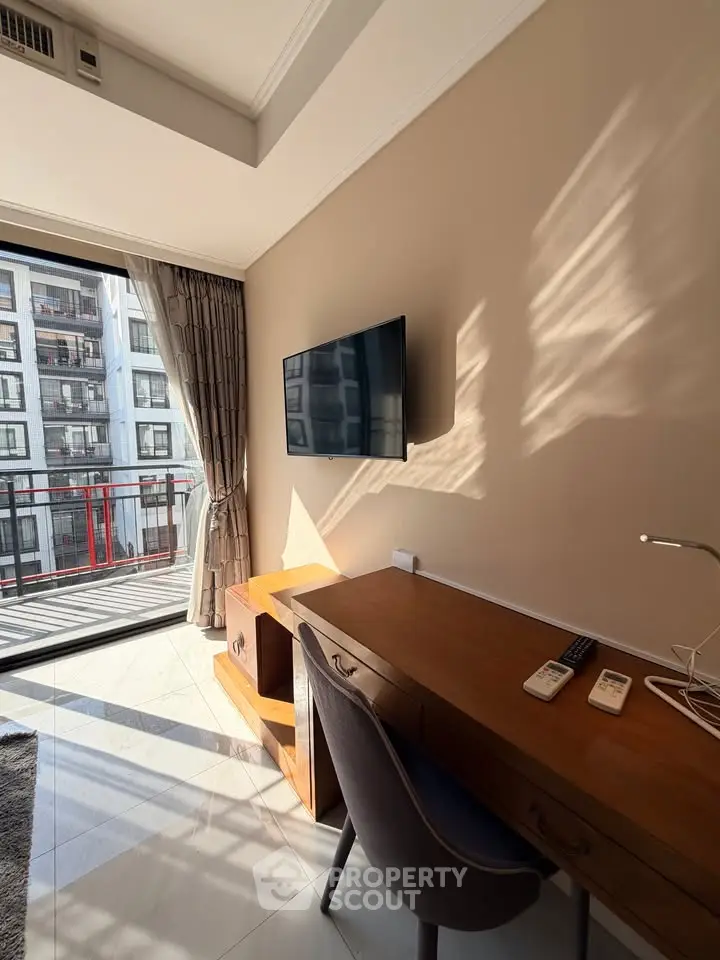 Modern study room with balcony view in a high-rise apartment