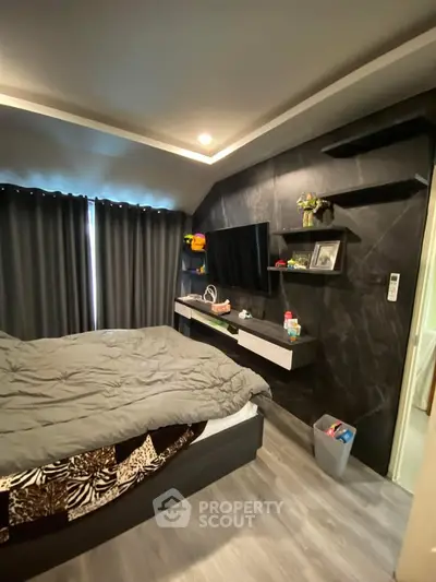 Modern bedroom with sleek design and cozy ambiance