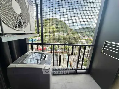 Modern balcony with washing machine and scenic mountain view