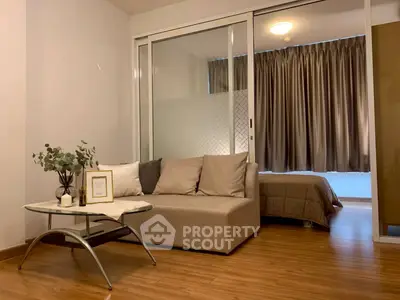 Modern studio apartment with cozy living area and bedroom