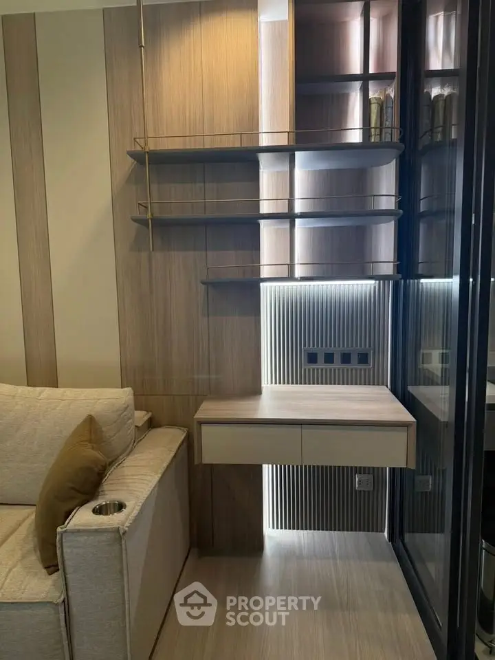 Modern living room with stylish wooden shelves and cozy sofa, perfect for urban living.