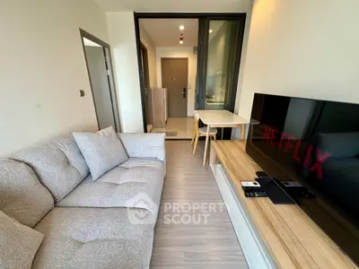 Modern living room with cozy sofa and large TV in a stylish apartment