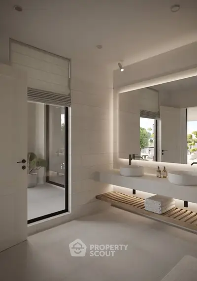 Luxurious modern bathroom with sleek design and large mirror, featuring natural light and elegant fixtures.