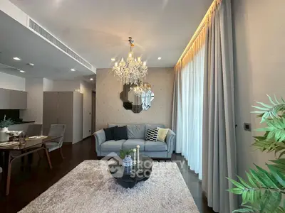 Luxurious living room with elegant chandelier and modern decor