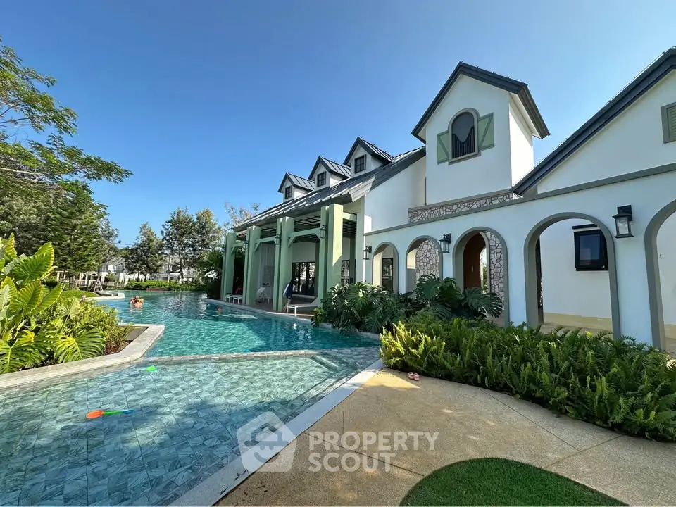 Luxurious villa with stunning pool and lush garden, perfect for relaxation and entertainment.