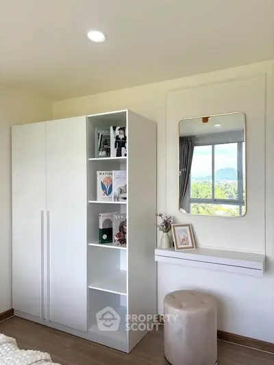 Chic bedroom corner with modern wardrobe and scenic window view