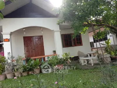 Charming single-story home with lush garden and inviting entrance.