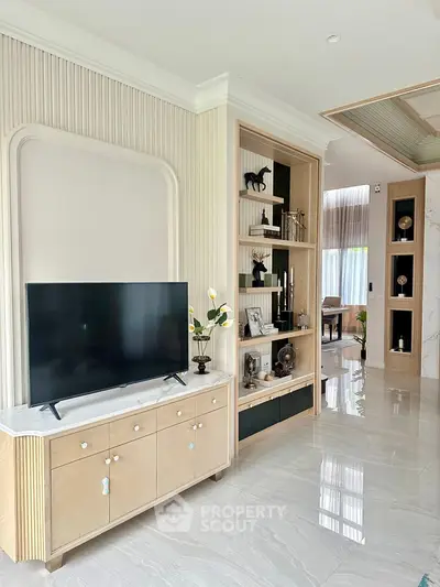 Luxurious living room with elegant decor and modern TV setup