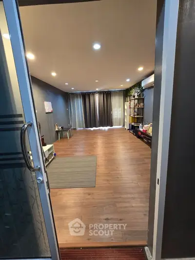 Spacious living room with wooden flooring and modern decor