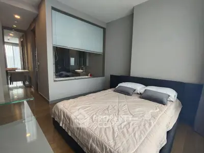 Modern bedroom with large window and elegant decor in luxury apartment