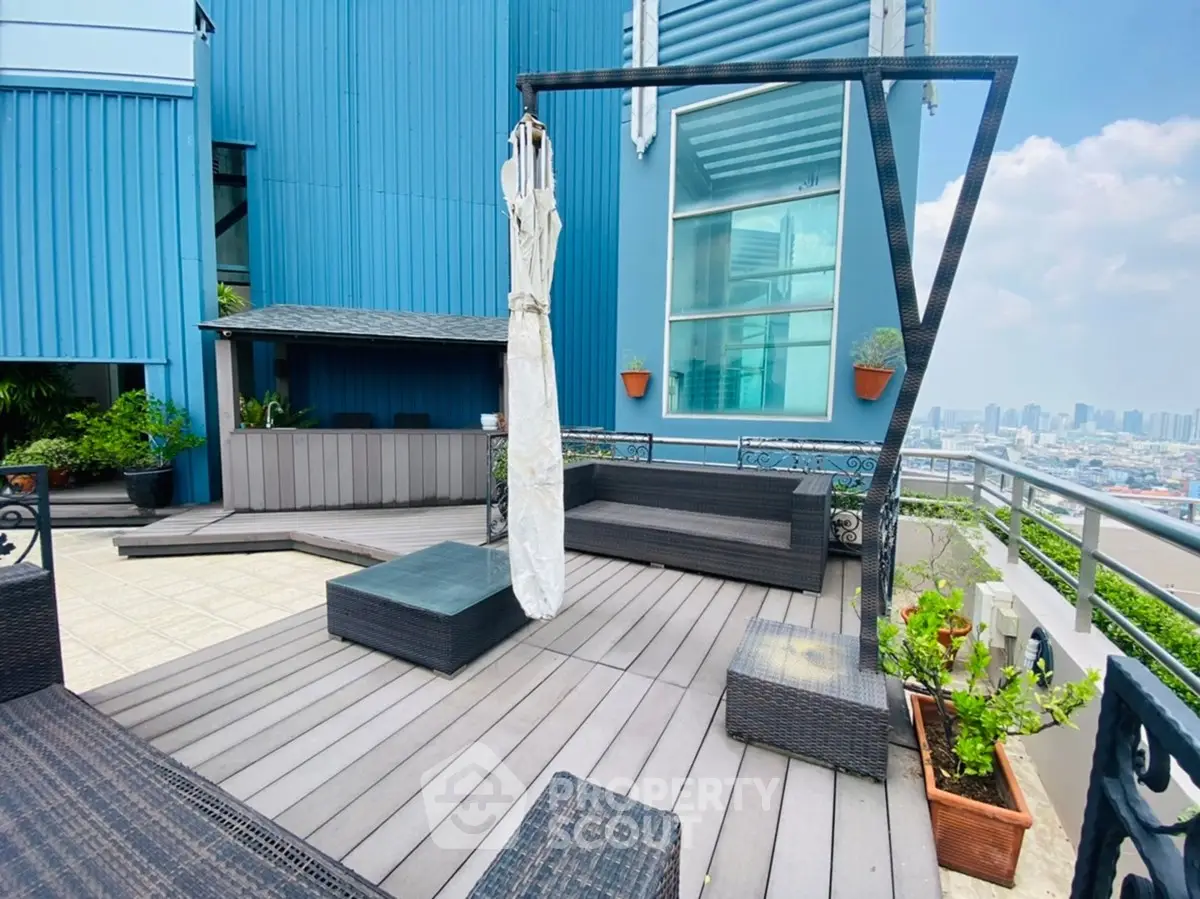 Stunning rooftop terrace with panoramic city views and modern outdoor seating.