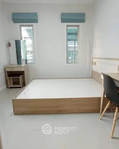 Minimalist bedroom with modern furniture and natural light