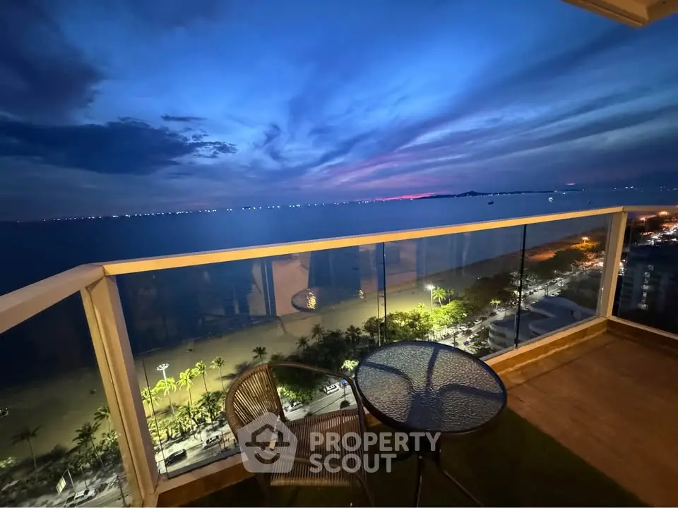Stunning ocean view from a high-rise balcony at sunset, perfect for relaxation and enjoying the scenery.