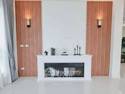 Elegant living room with modern fireplace and stylish wall sconces, perfect for cozy evenings.