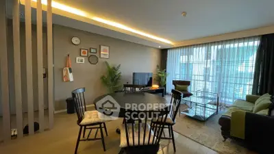 Modern living room with stylish decor and large windows for natural light