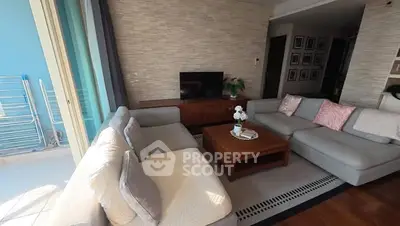 Spacious living room with modern decor and natural light