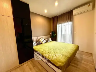 Modern bedroom with stylish decor and ample natural light