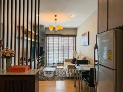 Modern living room with open layout, stylish decor, and natural light from large windows.