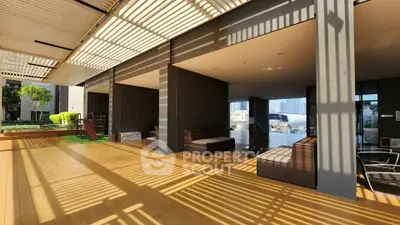 Modern outdoor terrace with stylish seating and pergola, perfect for relaxation and gatherings.