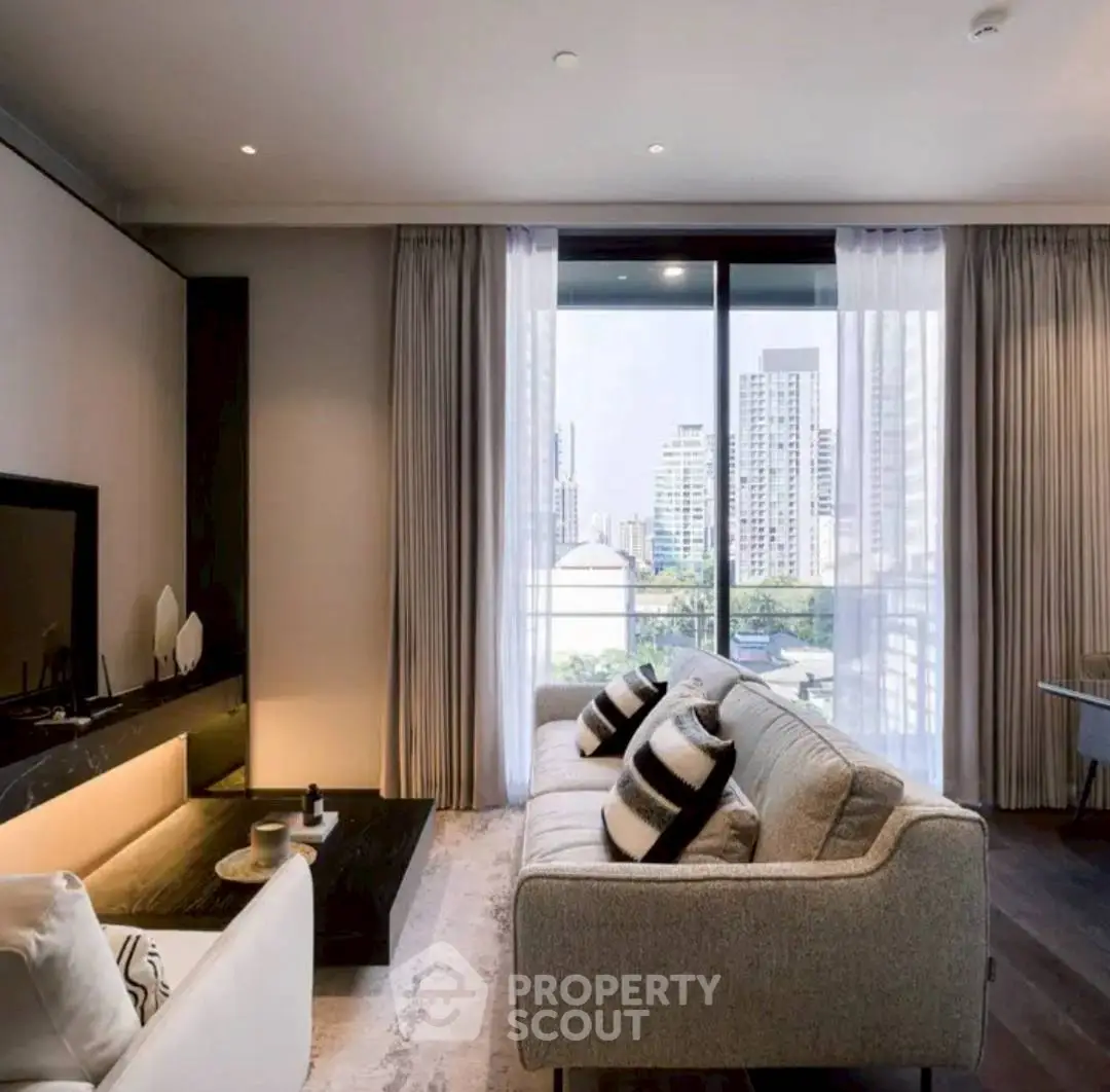Modern living room with city view, stylish furniture, and large windows for natural light.