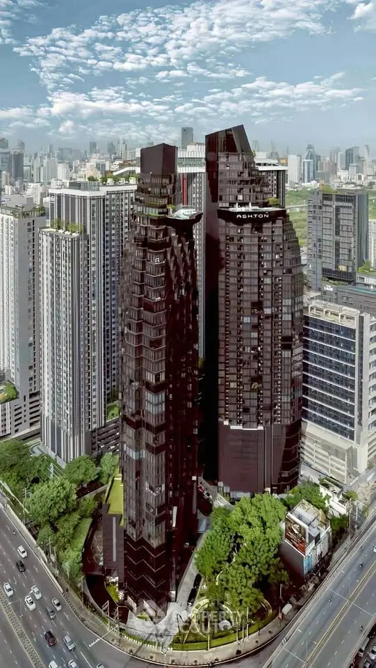 Stunning aerial view of modern high-rise buildings in a bustling cityscape, showcasing architectural elegance and urban living.