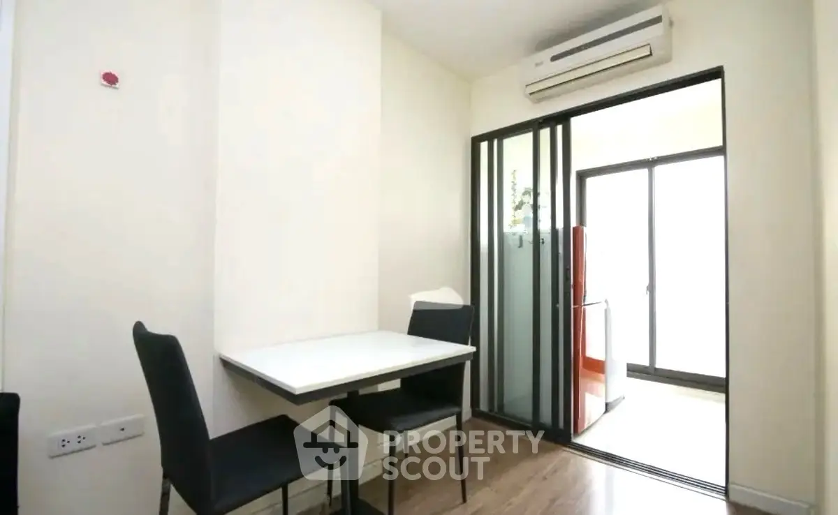 Modern dining area with sliding glass doors and air conditioning
