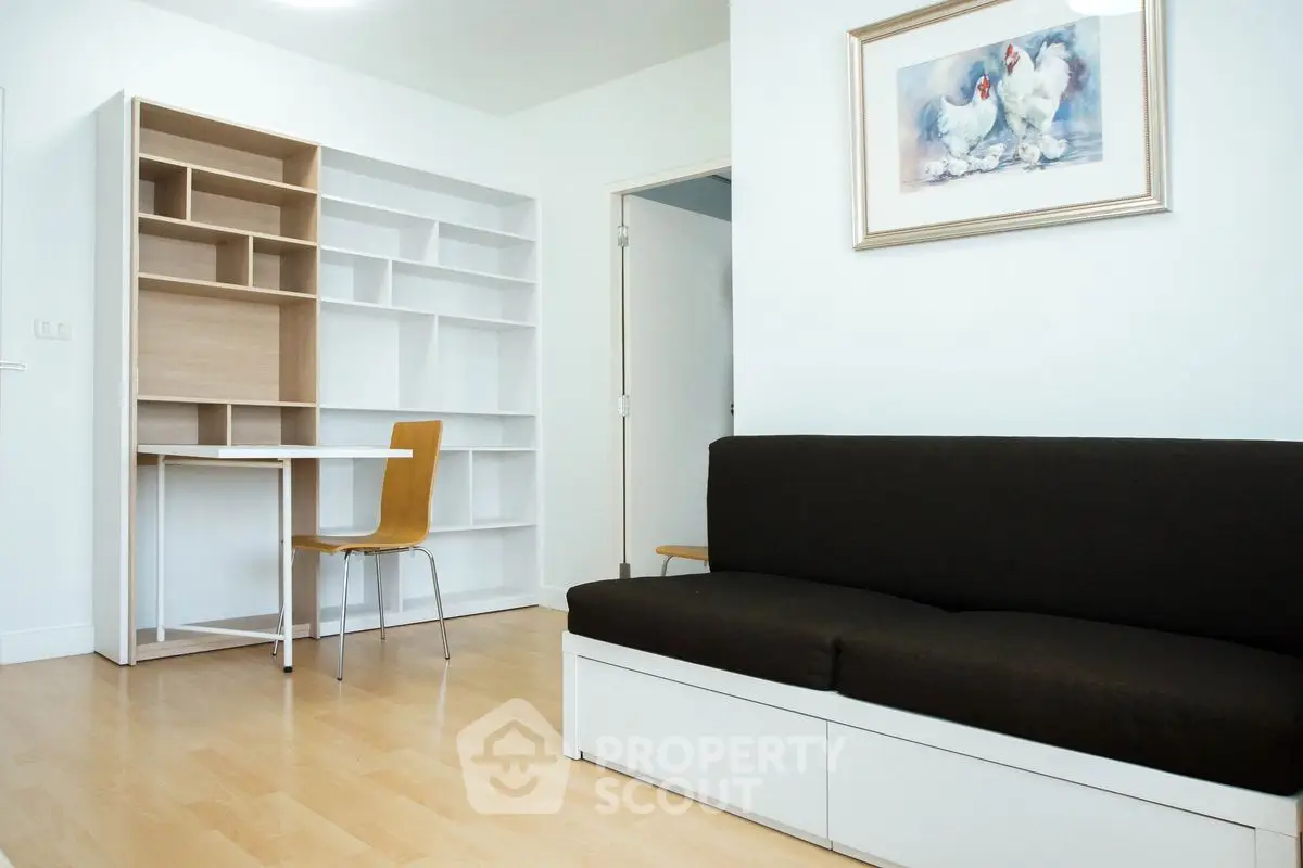 Modern living room with sleek furniture and built-in shelving