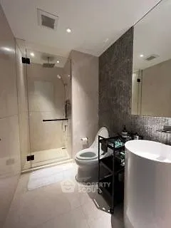 Modern bathroom with glass shower and sleek fixtures