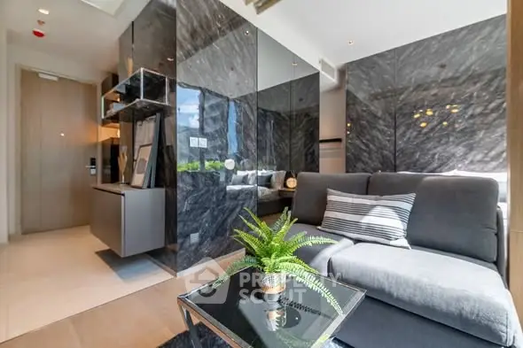 Luxurious modern living room with sleek marble walls and cozy sofa
