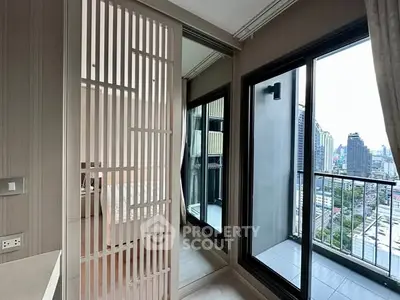 Modern apartment with city view and balcony access from bedroom