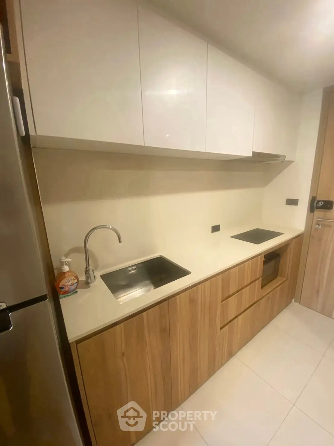 Modern kitchen with sleek cabinetry and built-in appliances