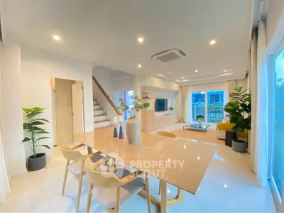 Spacious modern living and dining area with elegant decor and natural light