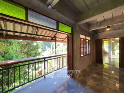 Charming balcony with lush green view and modern design elements