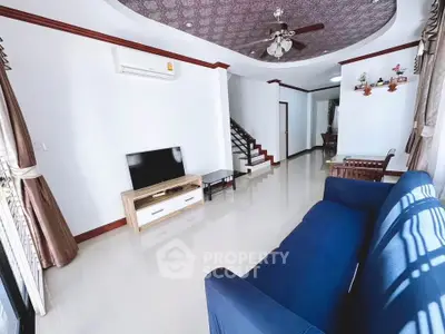 Spacious living room with modern decor and natural light