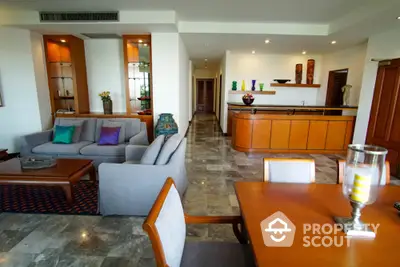 Spacious living room with modern decor and open layout, perfect for entertaining guests.