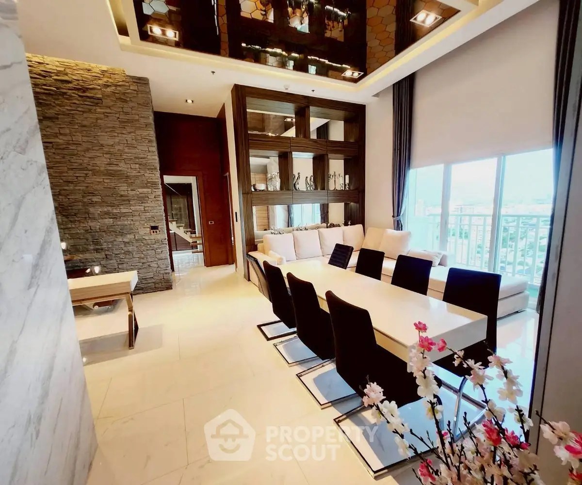 Luxurious modern living room with elegant dining area and panoramic city view.