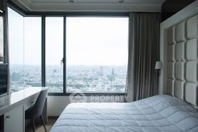 Luxurious bedroom with panoramic city view and elegant decor