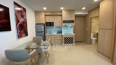 Modern kitchen with dining area and sleek wooden cabinetry