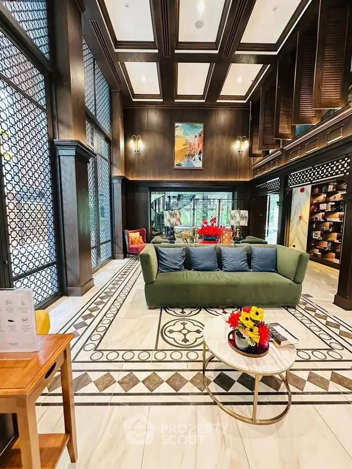 Luxurious living room with elegant decor and high ceilings in a modern home.