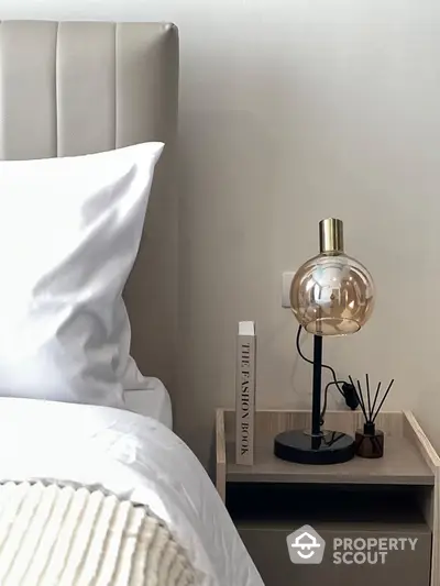 Elegant bedroom corner with modern lamp and stylish decor