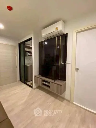 Modern living room with sleek air conditioning and stylish TV unit