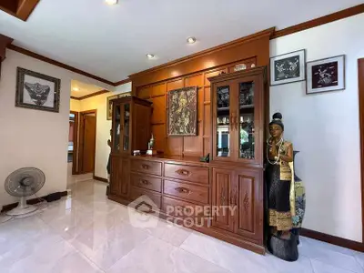 Elegant living room with wooden furniture and decorative art pieces