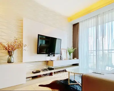 Modern living room with stylish decor and large window offering city views.